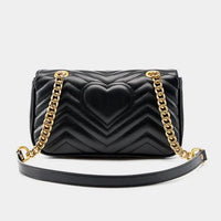 Black quilted leather handbag with heart design, gold chain strap, luxury purse