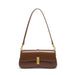 Brown leather shoulder bag with gold buckle and detachable strap on white background