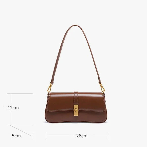 Brown leather shoulder bag with gold clasp, 26x12x5cm, on white background