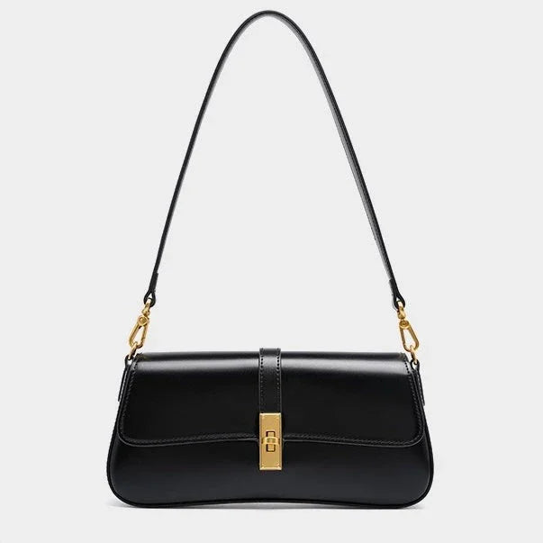 Black leather shoulder bag with gold clasp and hardware on white background