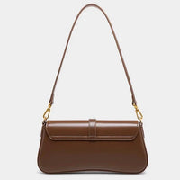 Brown leather shoulder bag with gold hardware on a white background