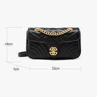 Black quilted leather shoulder bag with gold chain strap and logo, 23x14x7cm measurements