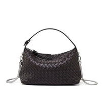 Black woven leather shoulder bag with silver chain strap on white background
