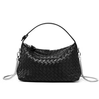 Black woven leather shoulder bag with silver chain strap on white background