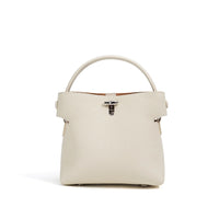 Ivory leather handbag with top handle and silver hardware on white background