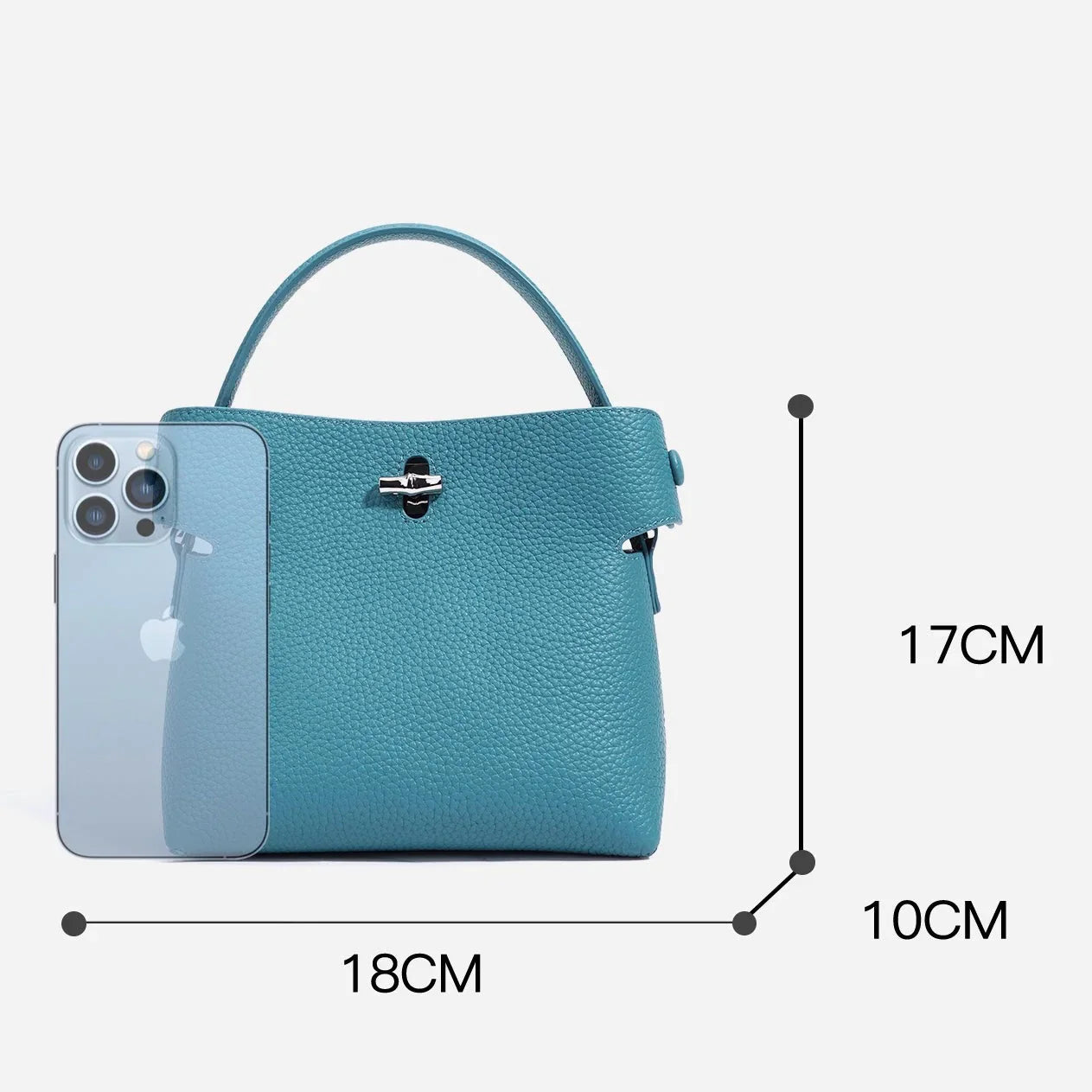 Blue leather handbag with top handle, silver clasp, iPhone for scale, bag size 18x17x10 cm.