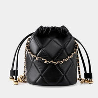 Black quilted leather bucket bag with gold chain strap and drawstring closure