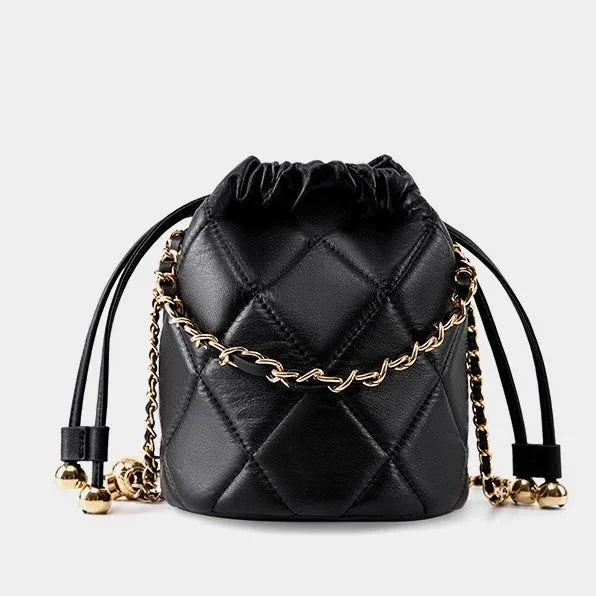 Black quilted leather bucket bag with gold chain strap and drawstring closure