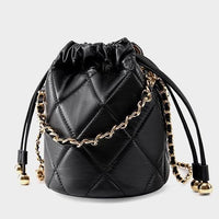 Black quilted leather bucket bag with gold chain strap and drawstring closure
