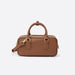 Brown leather satchel handbag with gold hardware and top handles on white background