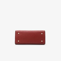 Red leather handbag base with gold studs on white background