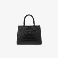 Black crocodile embossed leather handbag with top handles on white background