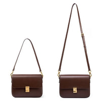 Two brown leather shoulder bags with gold clasps and adjustable straps on a white background