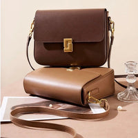 Two stylish leather crossbody bags in brown tones with gold hardware on a neutral background