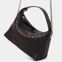 Black woven leather shoulder bag with metal chain strap on white background