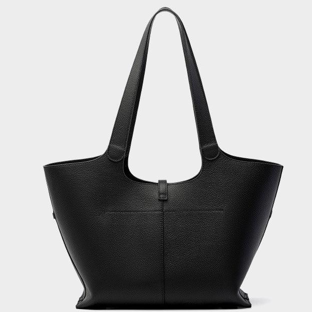 Black leather tote bag with double handles on a plain white background
