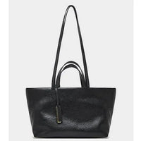 Black leather tote bag with double handles and gold accent, stylish minimalist handbag