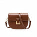 Brown leather crossbody bag with gold buckle and adjustable strap on white background