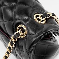 Black quilted leather handbag with gold chain strap and hardware