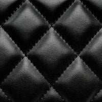 closeup of black quilted leather texture with diamond stitching pattern