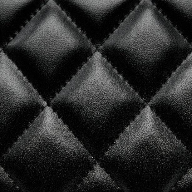 closeup of black quilted leather texture with diamond stitching pattern