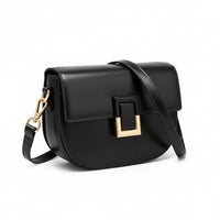 Black leather crossbody bag with gold buckle and adjustable strap on white background