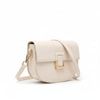 Cream leather crossbody bag with gold buckle and adjustable strap on white background