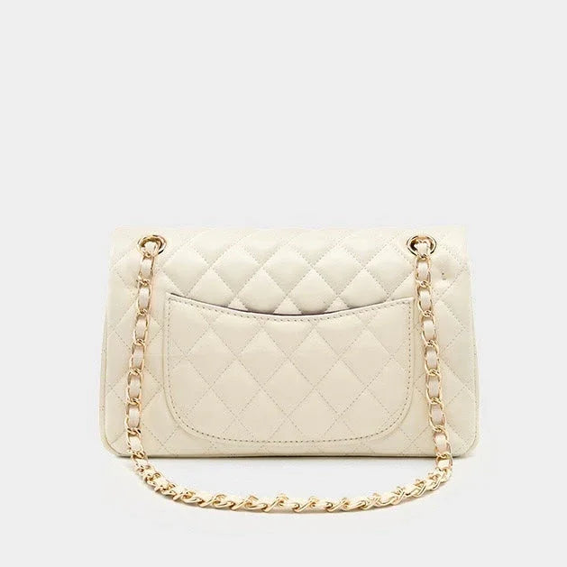 Cream quilted leather shoulder bag with gold chain strap on white background