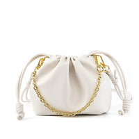 White drawstring pouch handbag with gold chain on white background