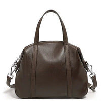 Dark brown leather handbag with top handles and detachable shoulder strap on white background