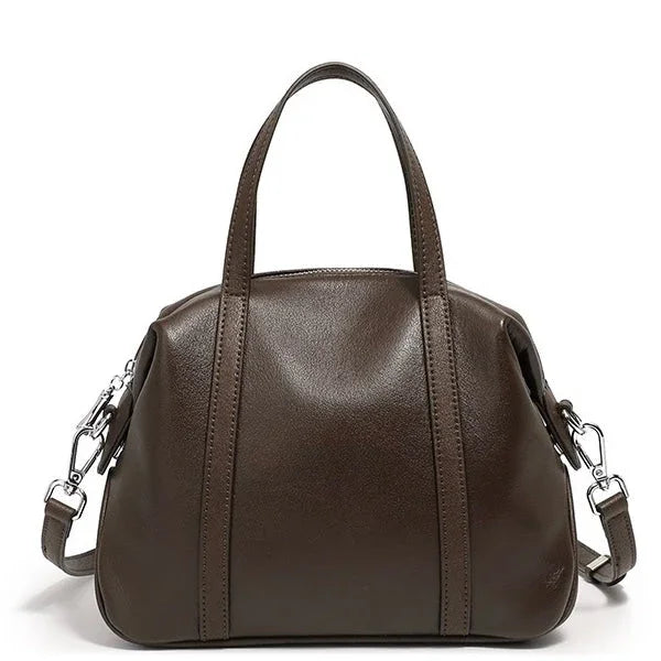 Dark brown leather handbag with top handles and detachable shoulder strap on white background