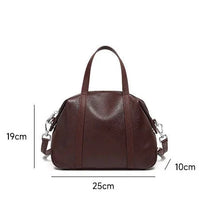 Brown leather handbag with shoulder strap, dimensions 25x19x10cm, on white background