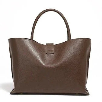 Brown leather tote bag with top handles on a white background