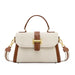Beige and brown leather handbag with gold hardware and detachable shoulder strap