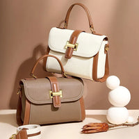 Two stylish handbags with brown trim and gold clasps on a beige background