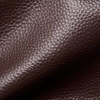 Close-up of textured dark brown leather material with visible grain pattern