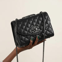 Black quilted leather shoulder bag with chain strap and silver logo clasp