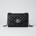 Black quilted leather shoulder bag with silver chain strap and metallic logo clasp