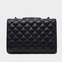 Black quilted leather handbag with chain strap on a plain gray background