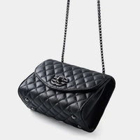 Black quilted leather shoulder bag with chain strap on white background