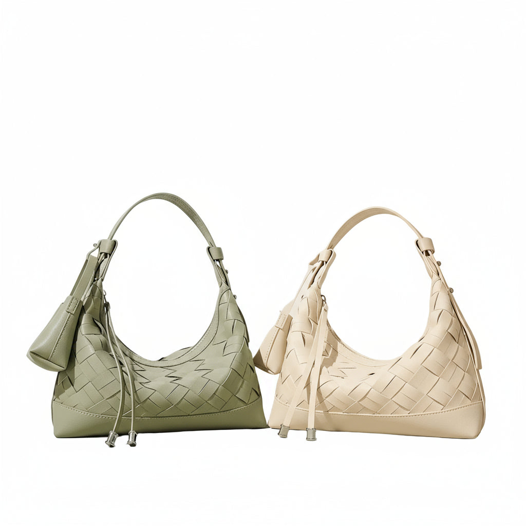Two woven leather shoulder bags, one sage green and one cream, on a neutral background.