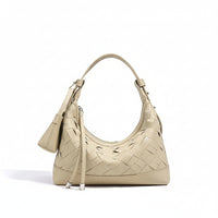 Beige woven leather shoulder bag with top handle and attached pouch on white background