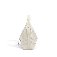 White woven leather sling bag with buckle and drawstring on white background