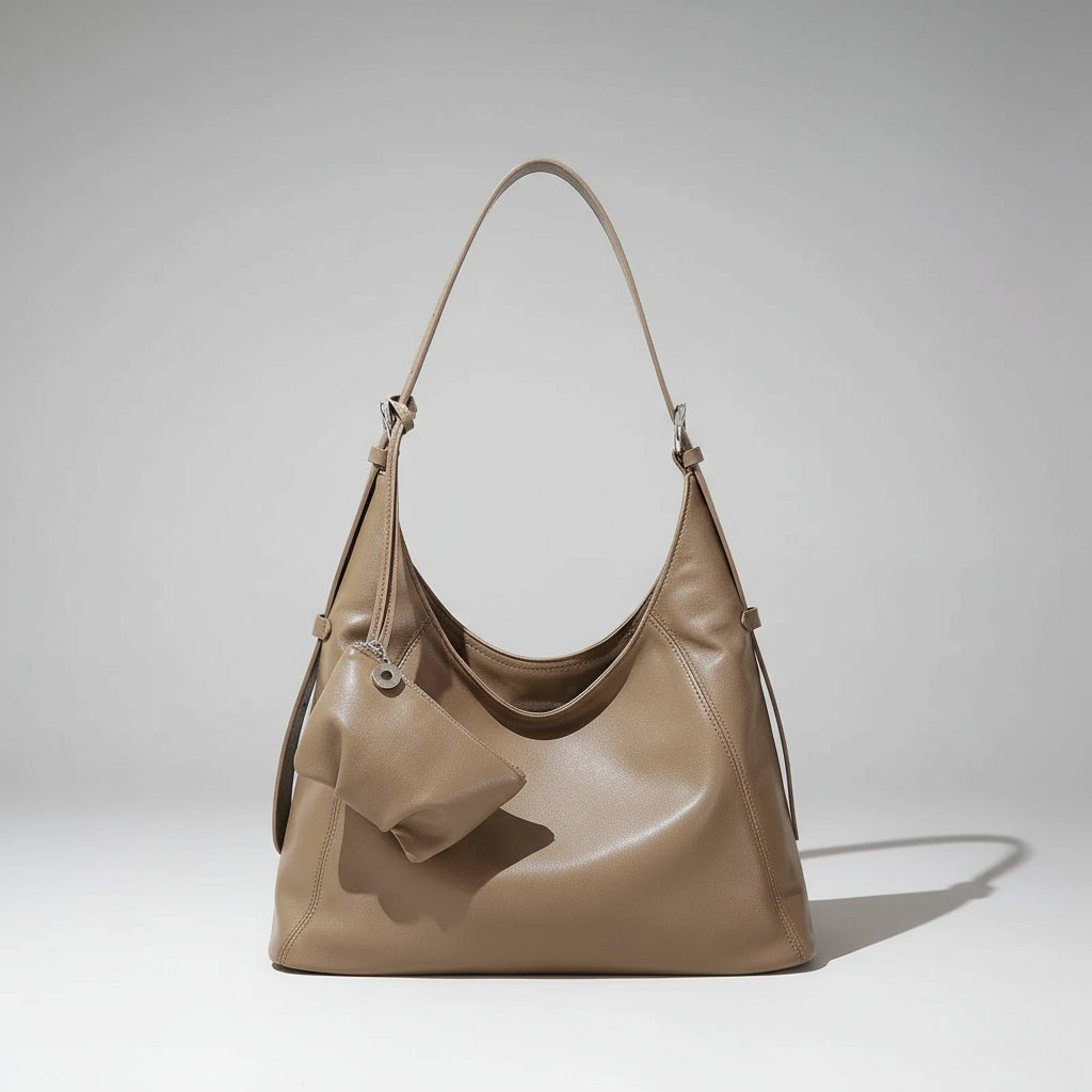 Taupe leather hobo handbag with matching pouch, minimalist background, soft shadow
