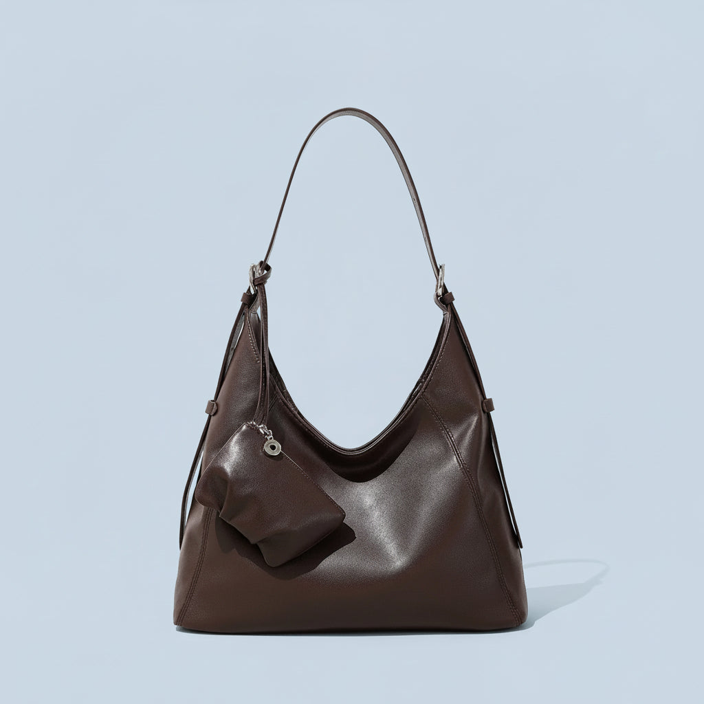 Dark brown leather hobo bag with pouch, minimalist background, stylish women's handbag