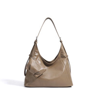 Taupe leather hobo bag with a mini pouch accessory on a white background