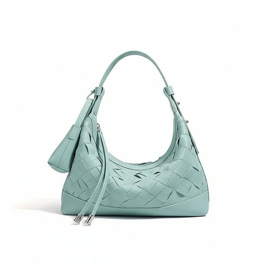 Mint green woven leather shoulder bag with zipper and matching pouch on white background