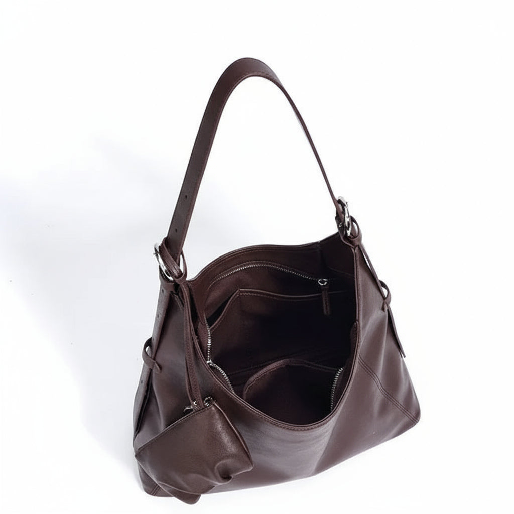 Brown leather shoulder bag with multiple compartments on white background