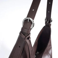 Brown leather shoulder bag with silver buckle detail on strap