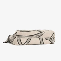Beige canvas zipper pouch with black abstract line art pattern on white background